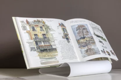 Lutrinarium petit modèle blanc laqué avec le livre Vallée de la Loire aquarelles de Fabrice Moireau aux Éditions du Pacifique.